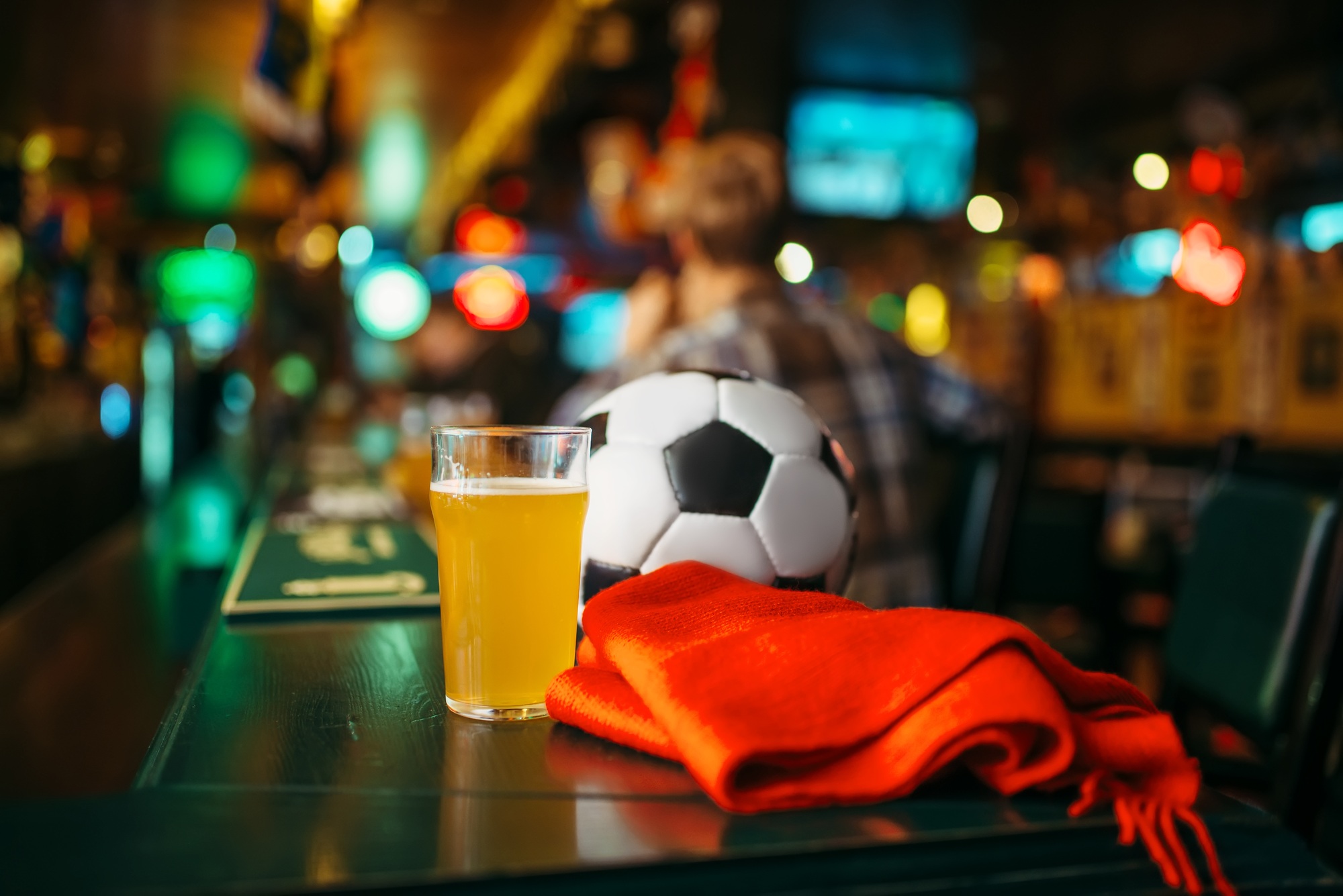 Ball, beer and scarf in sports bar, fans lifestyle